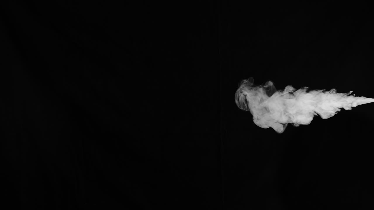 premium-stock-video-slow-motion-stream-of-smoke-from-right-side-of