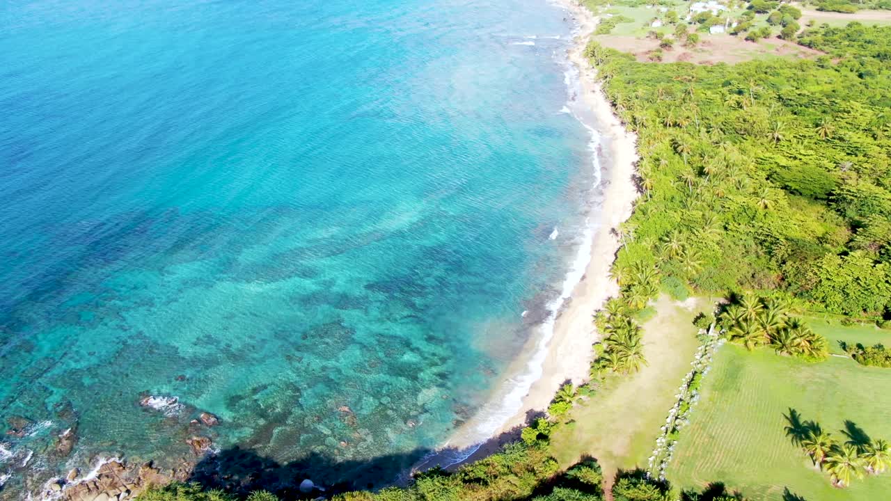Panoramic view of El Cocal beach, Puerto Rico. Aerial flying backwards
