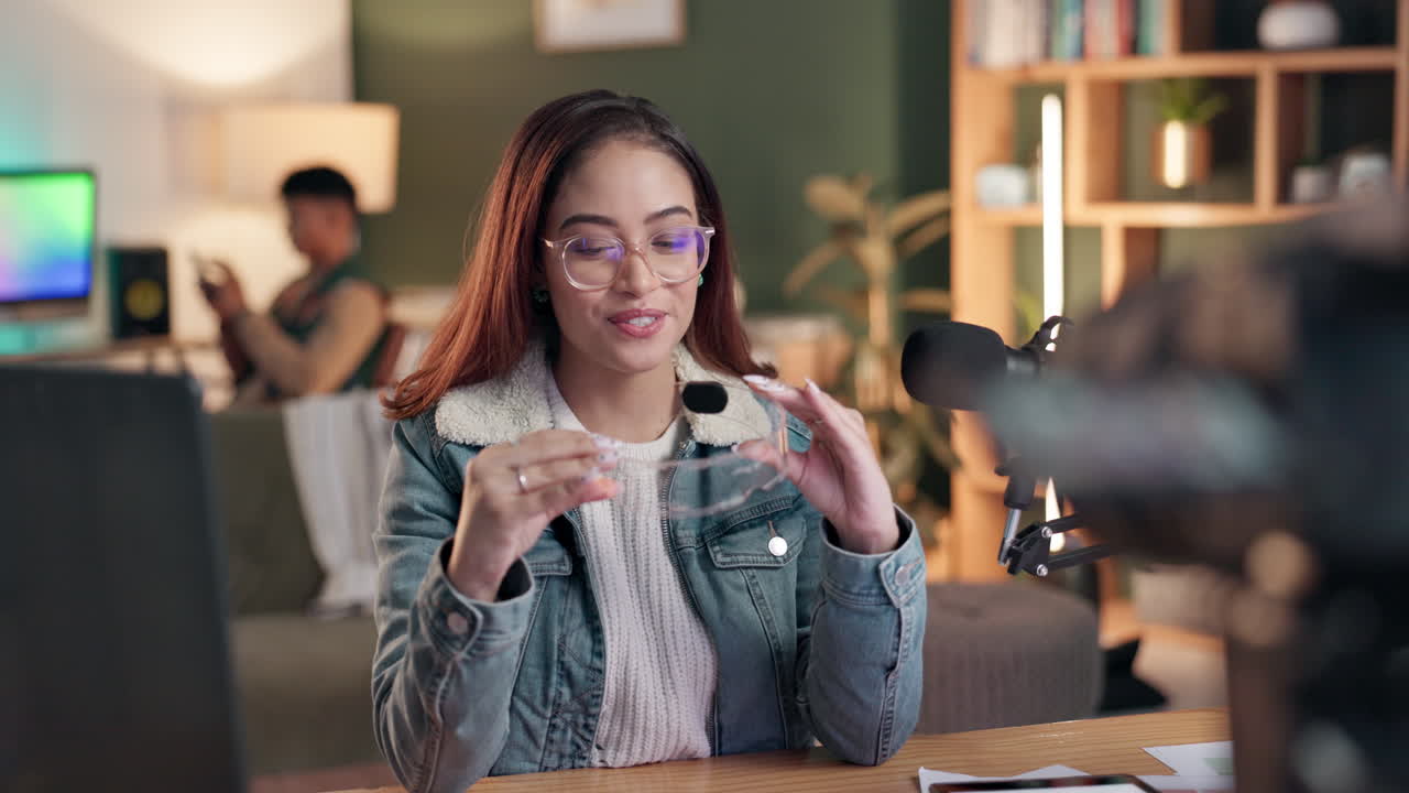 Woman Vlogging with Microphone and Glasses