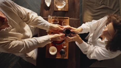 two people having a traditional tea ceremony