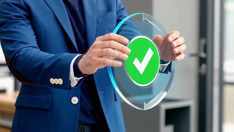 businessman interacting with a futuristic hologram of a green check mark