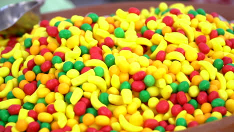 unhealthy yellow, red and green candies in bulk