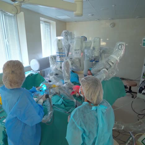 doctors performing surgery with medical robot. surgical team during surgery in modern operating room