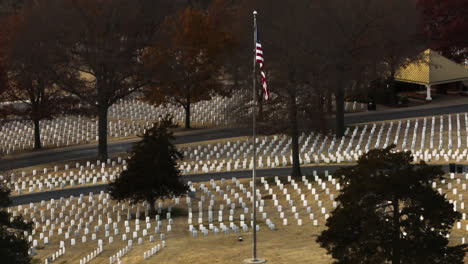 fayetteville national cemetery, aerial flying around american flag on pole