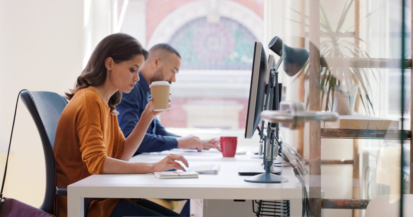 Portrait of young diverse business team at work. Bright contemporary small creative business. Casual young people in new creative business office or architects company
