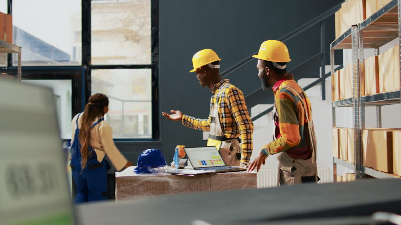 Warehouse Workers Discussing Inventory
