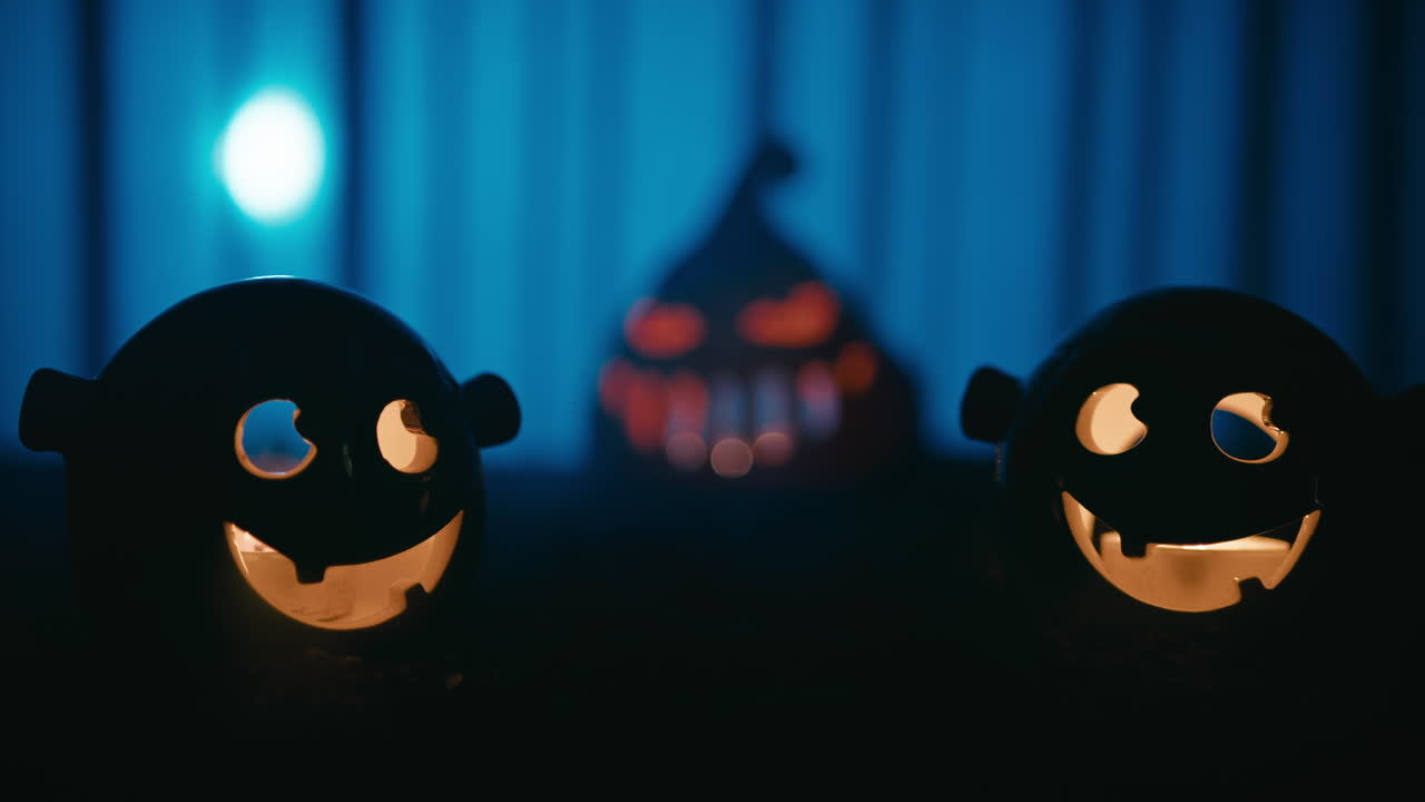 Smiling Halloween monsters and pumpkin teacher in the background