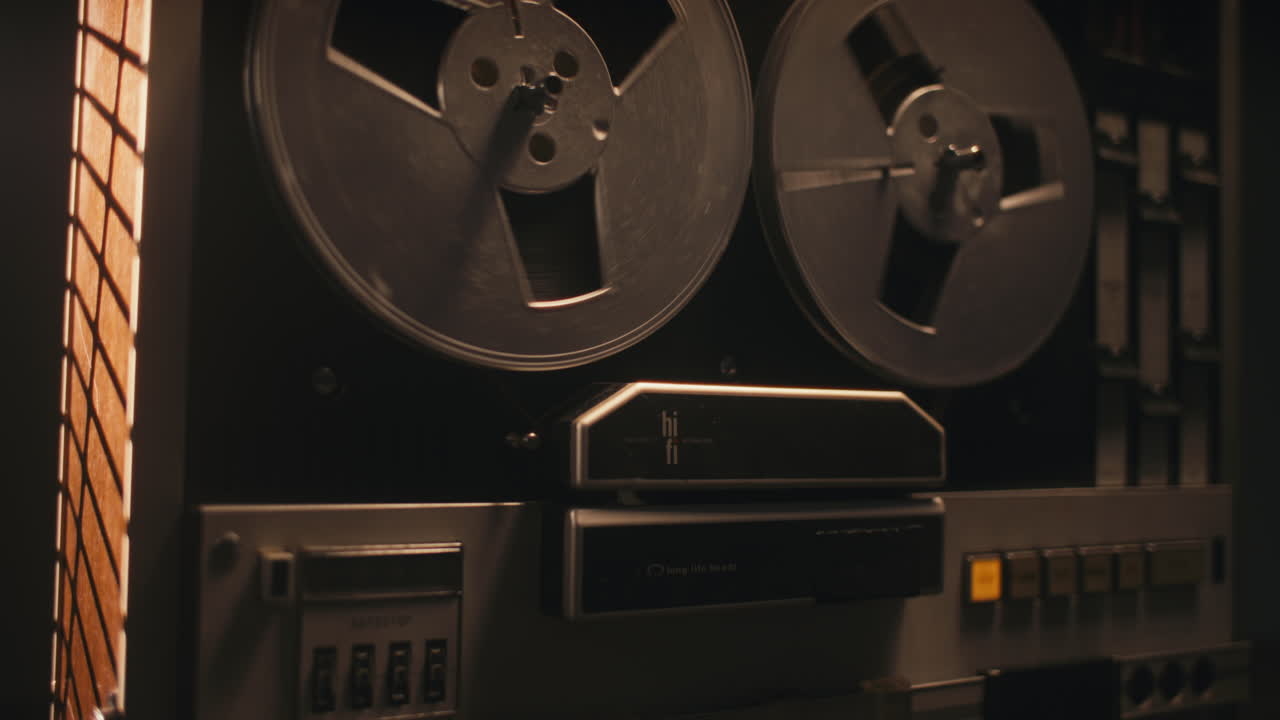 A vintage tape recorder in a blinking light