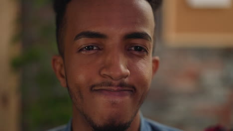 handsome young african-american man with mustache and beard