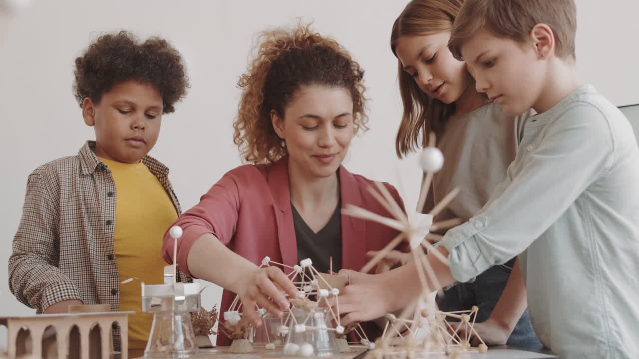 Teacher and Students Celebrating School Project