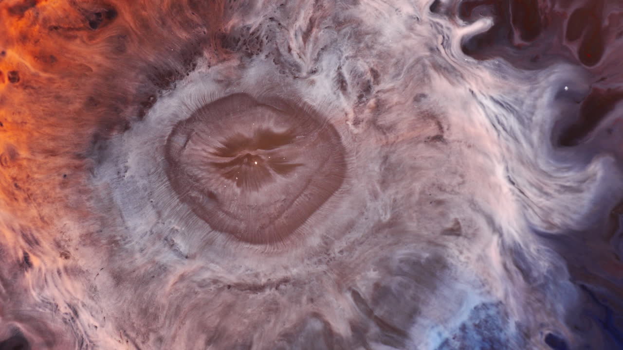 Colored Ink Mixing In Water Forming Abstract Background