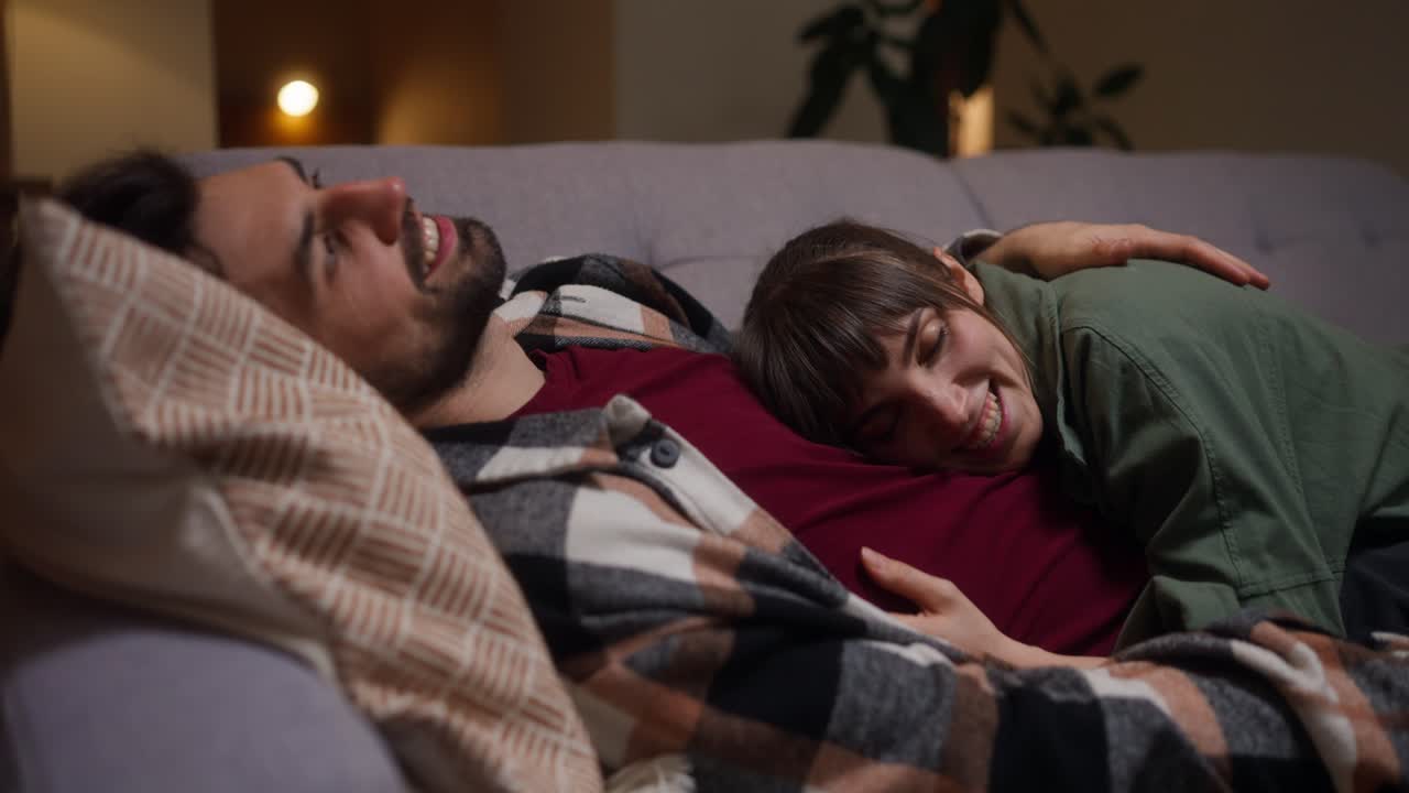 A couple enjoys a cozy moment together