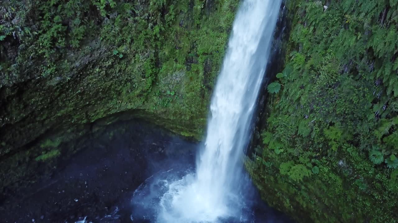 Rainforest Paradise and Pristine Nature. Aerial View of Waterfall Deep in Jungle of Chile