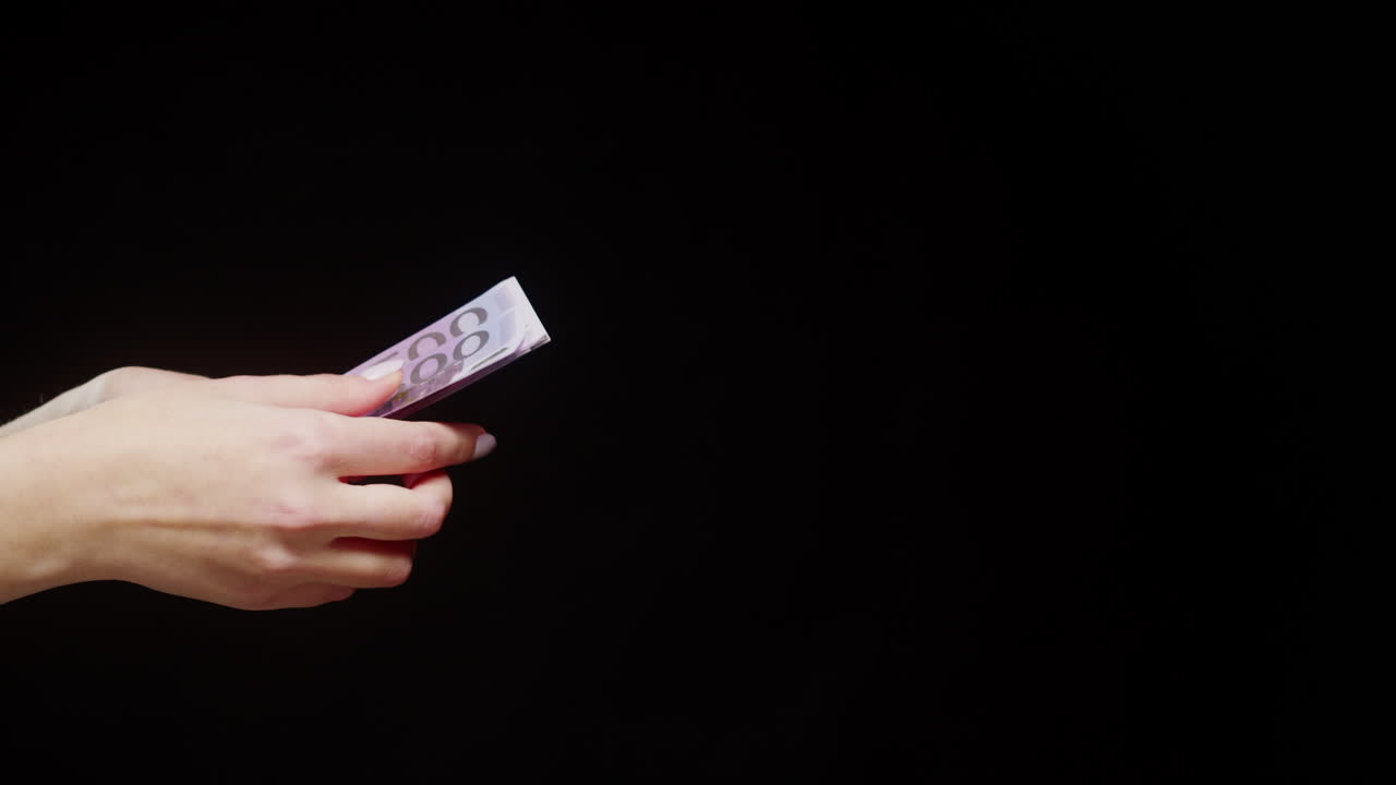 Euro banknotes in hand