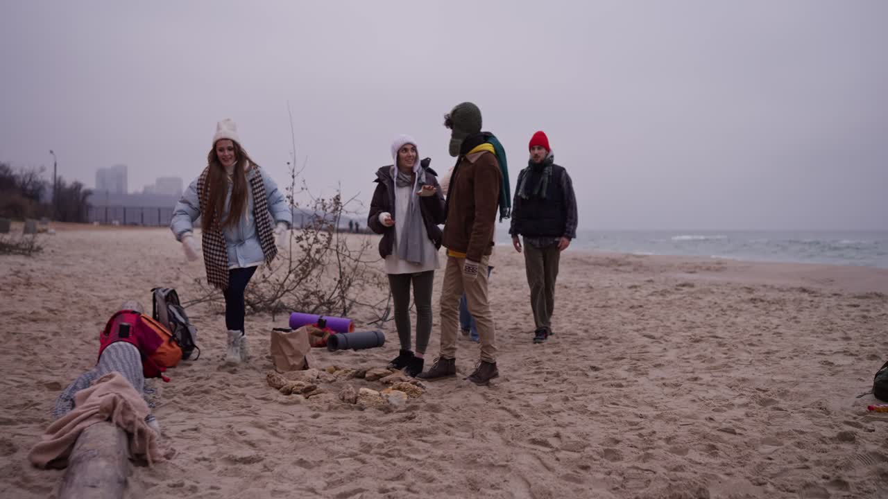 Friends Having Fun on a Winter Beach