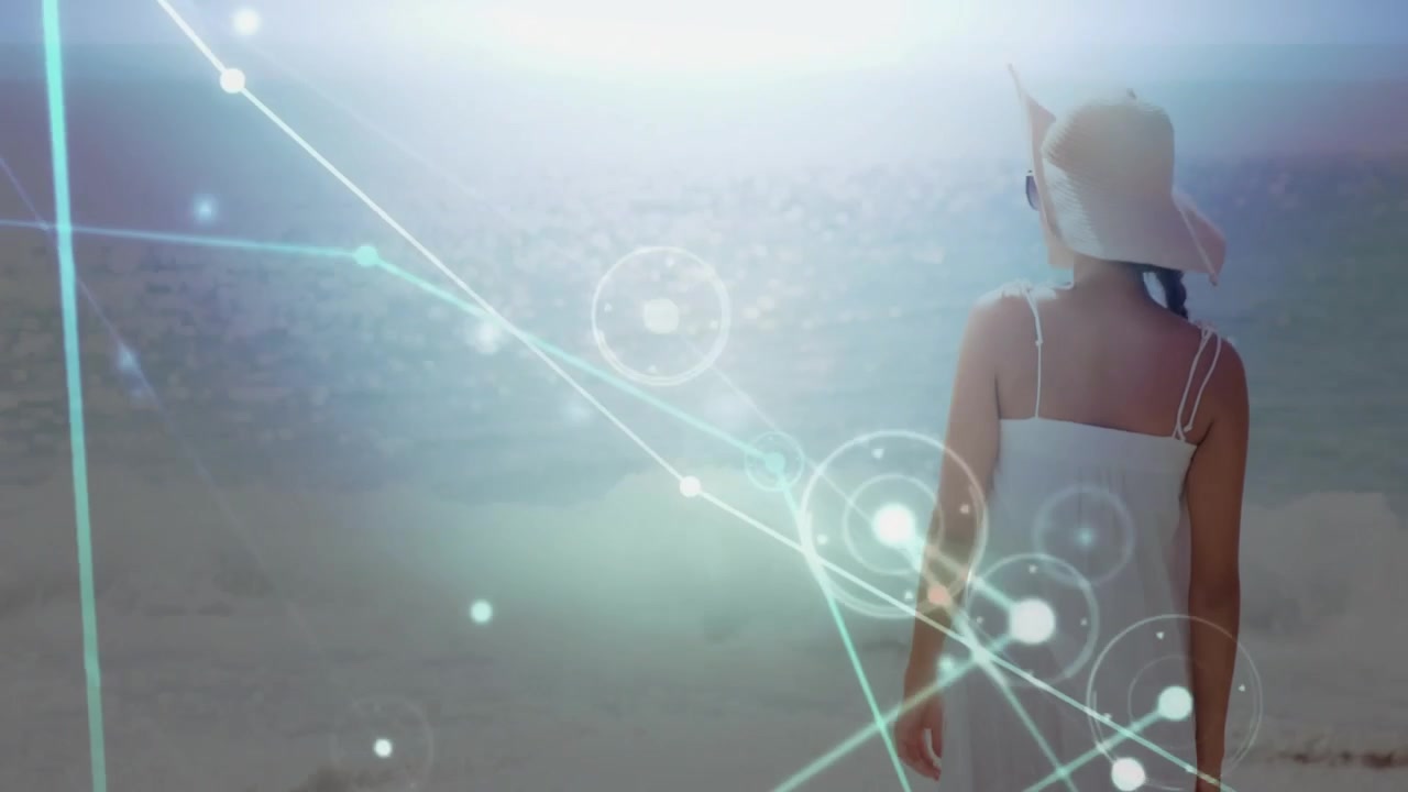 Woman walking to horizon on shore tech nodes appearing across frame and crossing feet, seeking calm