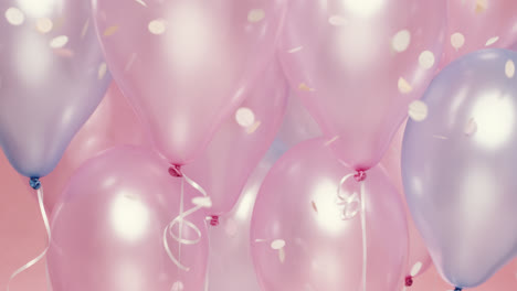 confetti falling  in slow motion pink and blue balloons background - red epic dragon