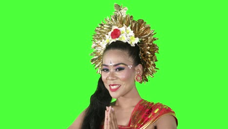 balinese dancer showing a welcoming gesture