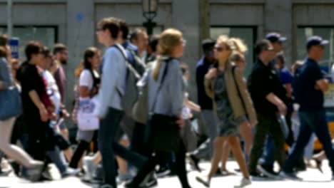 side view blurry pedestrians walking.