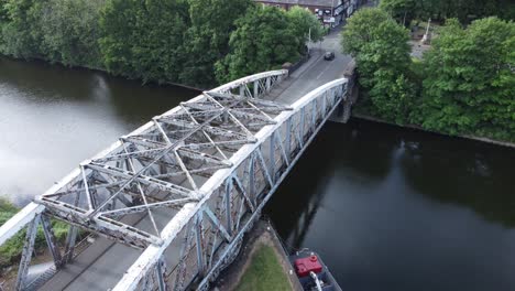 aerial view descending to cyclist crossing manchester ship canal swing bridge warrington england