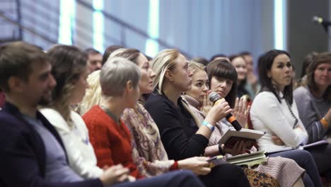 conference attendees listening to speaker