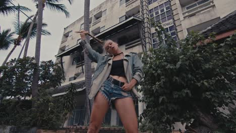 woman in denim outfit posing outdoors