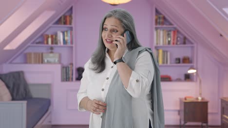 Happy-Indian-mother-talking-on-phone