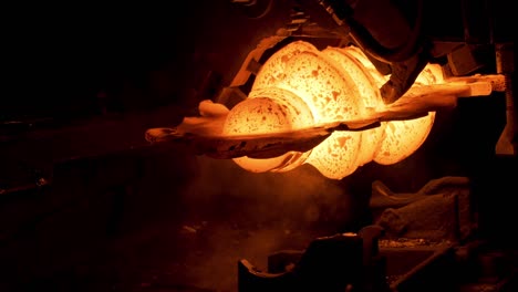 close up of red hot steel detail at the steel plant, heavy metallurgy concept. scene. the process of metal parts production in a furnace at the hot workshop