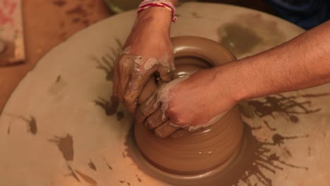 potter at work makes ceramic dishes. india, rajasthan.