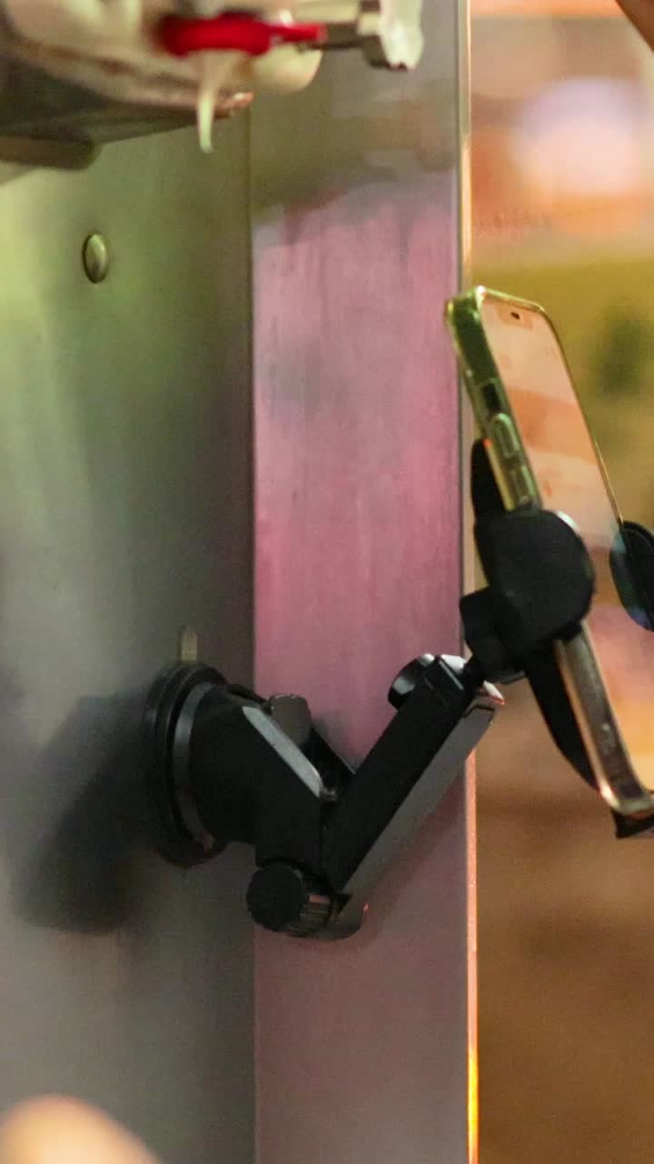 Person serving ice cream from a machine