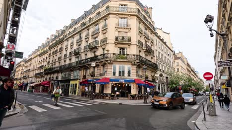 time-lapse of traffic and pedestrians at a city crossroad