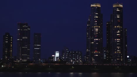 nighttime in seoul with tall skyscrapers isolated on dark night sky