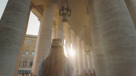 Woman walking among columns