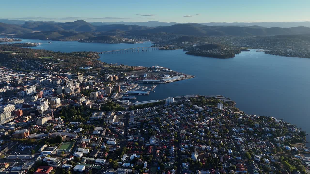 Overview shot of the Harbor of Hobart city with landscape on the other side, aerial footage