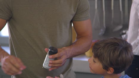 Family-In-Kitchen-Making-Morning-Breakfast-Together