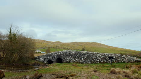 slow zoom on the iconic quiet man bridge in connemara, galway, ireland.