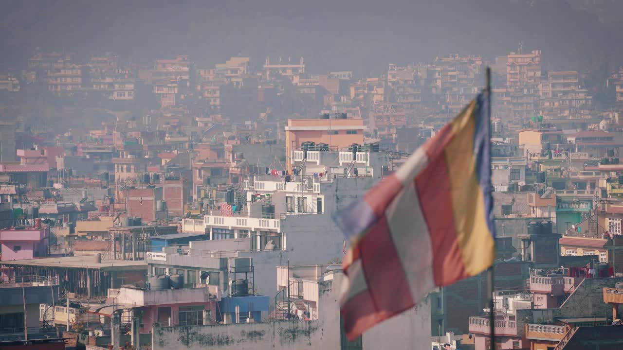 A Wide Cityscape on its Background with Different Flags at the Corner at Kathmandu, Nepal- Wide SHot