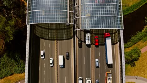 top down static drone view of warsaw city tunnel with cars trucks and bus moving