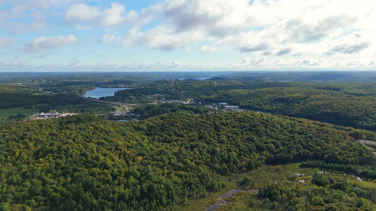 Expansive forest and lakes surround Huntsville in Muskoka, Ontario, Canada Aerial