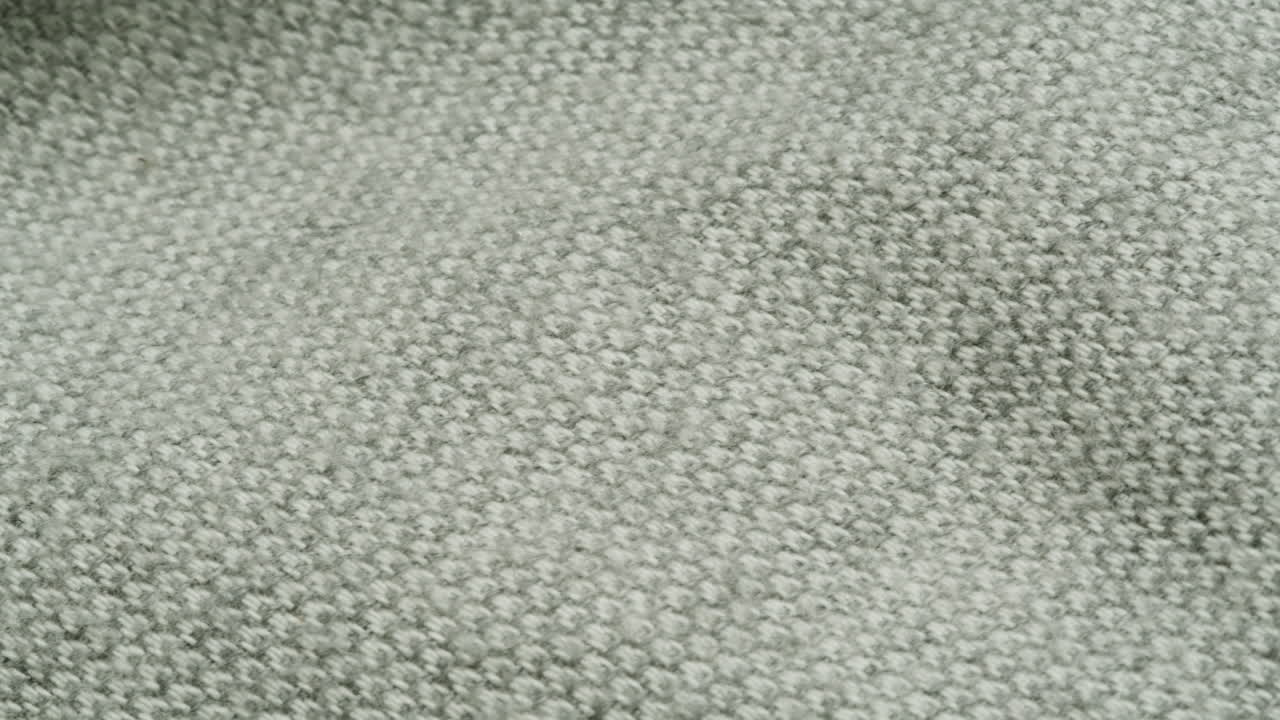Close-up view of a grey knit fabric texture