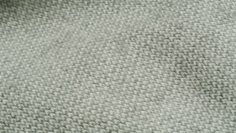close-up view of a grey knit fabric texture