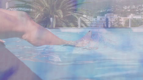 relaxing in rooftop pool, person with cityscape and palm tree view