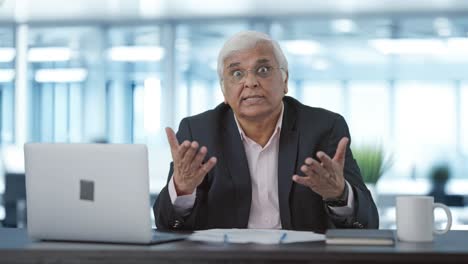 angry senior indian businessman shouting on someone