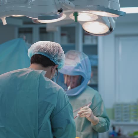 medical team performing operation. modern equipment in operating room