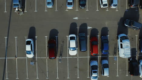 copter filming modern cars parking near supermarket parking lots