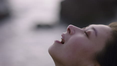 close up portrait beautiful asian woman looking up praying contemplating journey enjoying calm seaside at sunset exploring spirituality feeling inspired