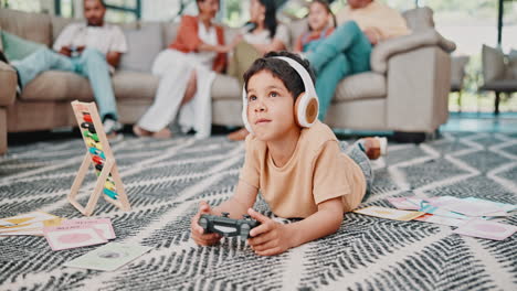 child playing video games at home with family