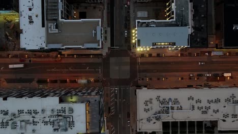 aerial view above quiet, illuminated streets of downtown columbus, usa - top down, drone shot