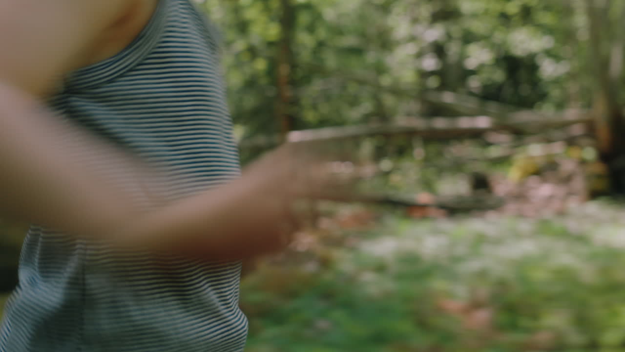 Young tomboy does warm-up before running through pristine Scandinavian woods