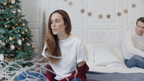 young couple having quarrel in luxury bedroom